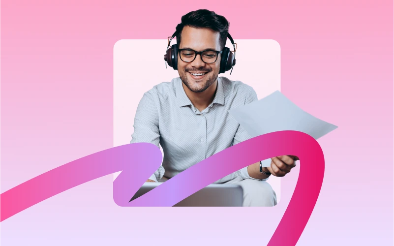 A man wearing headphones and glasses smiles while looking at papers, with a pink and purple ribbon design in the foreground.